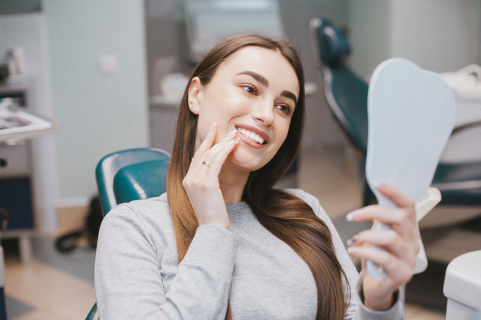 woman smiling at the dentist