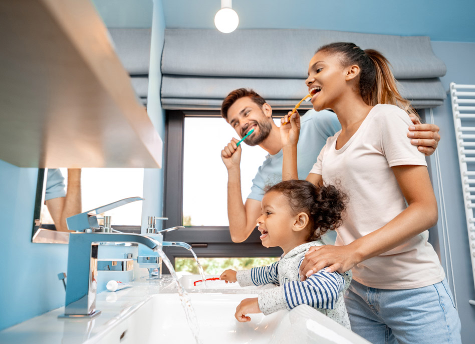 family brushing their teeth together at home